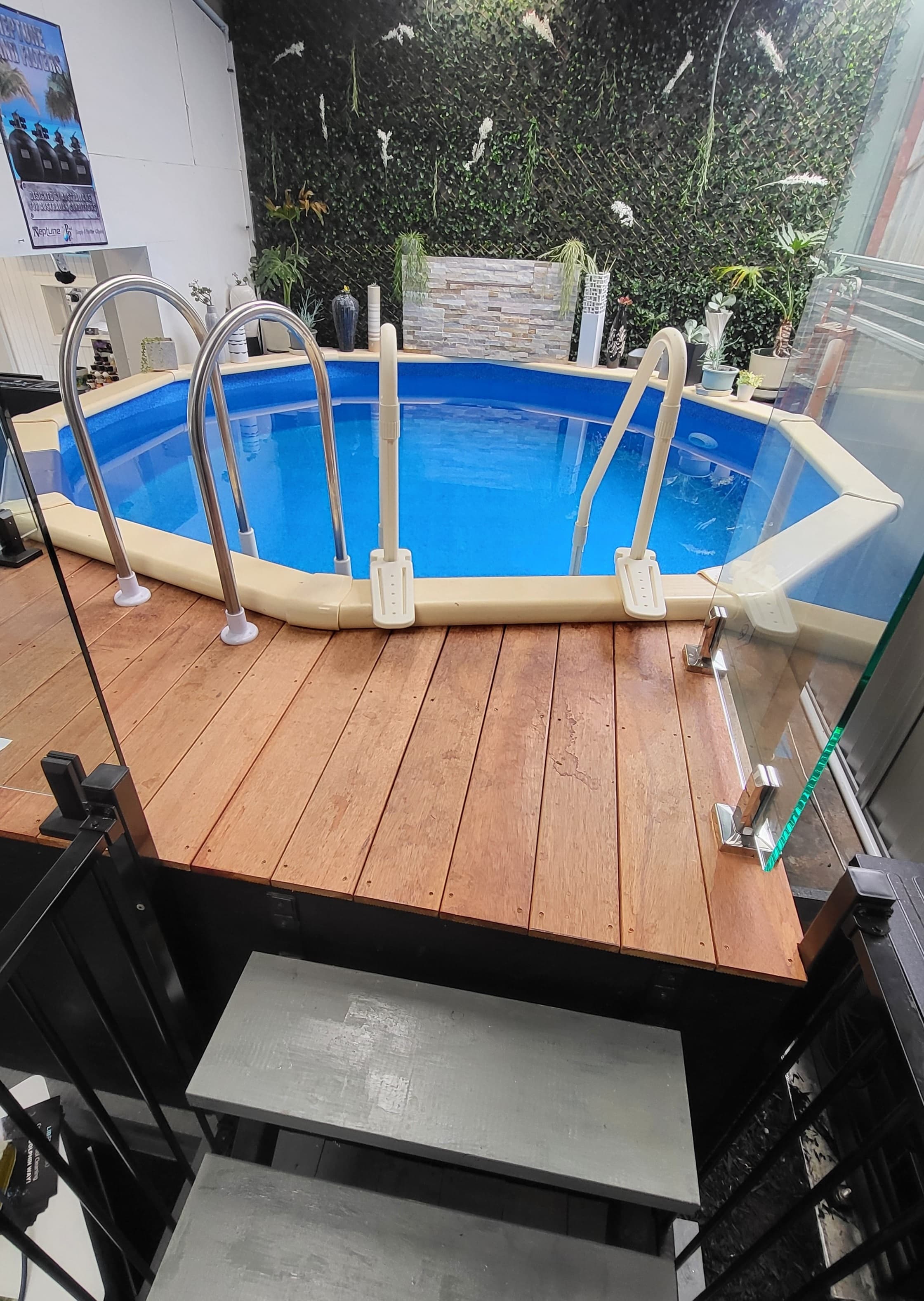 Above-ground pool with timber deck on display in the Cowes showroom