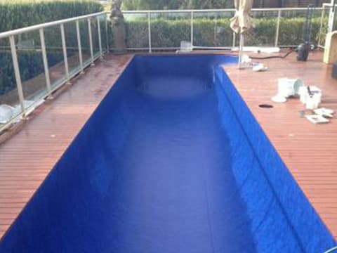 Renovated pool with new liner and timber decking
